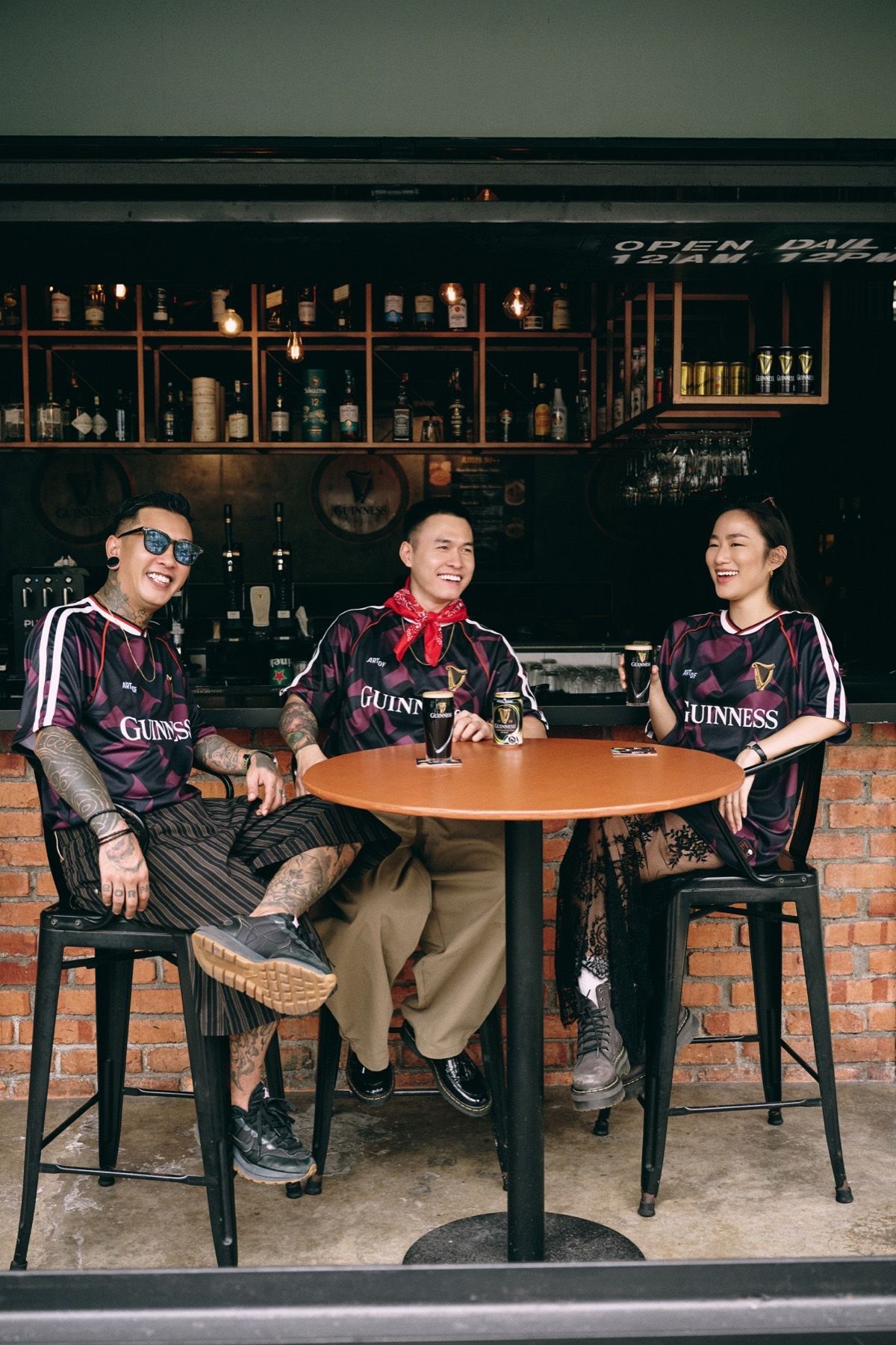 Three models at a round bar table