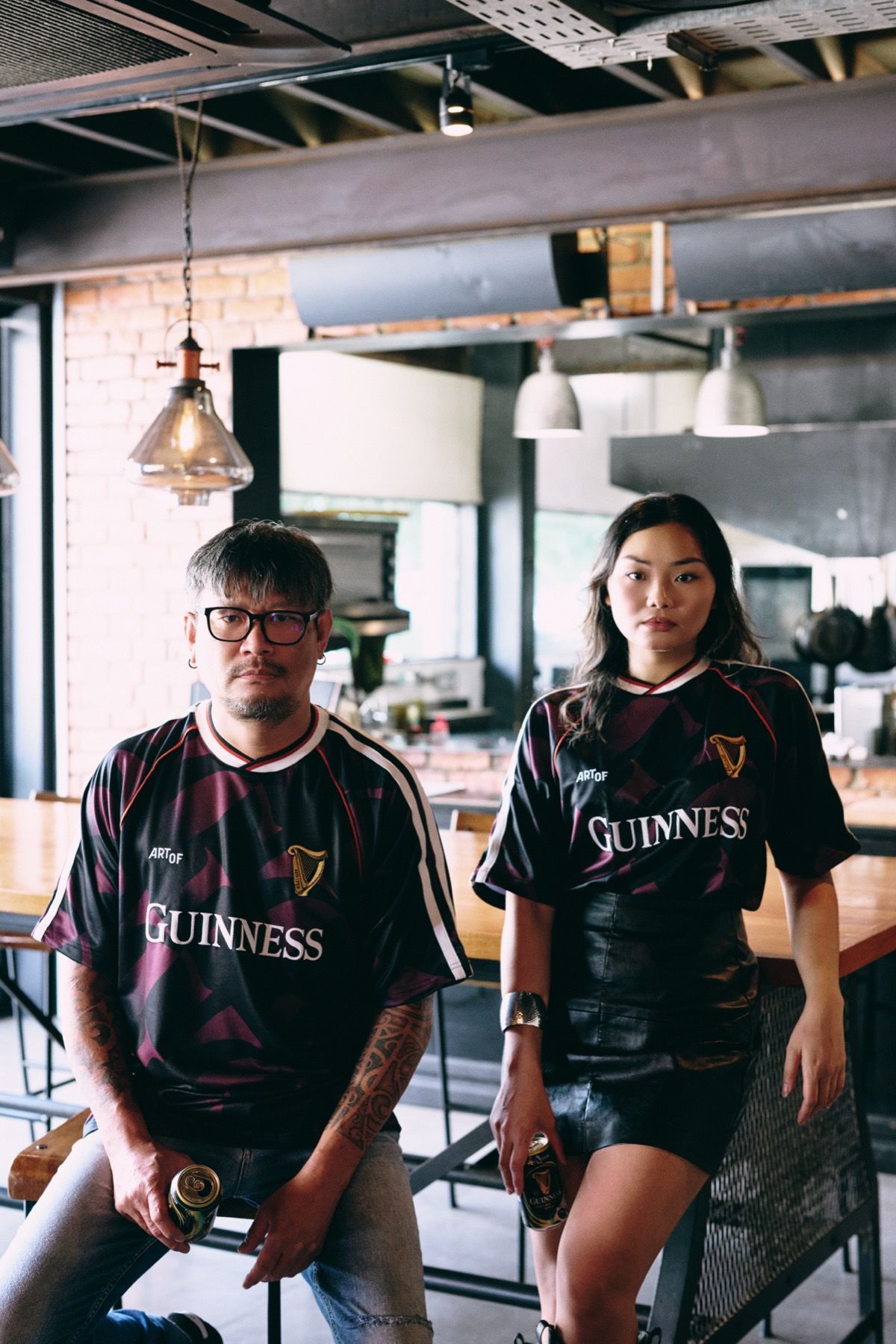 Two models in the jersey under a bar canopy