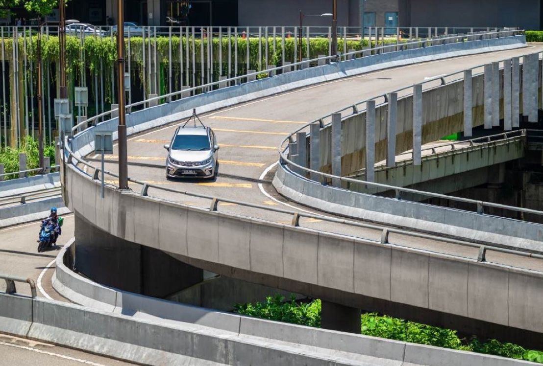A mapping car on a curving flyover