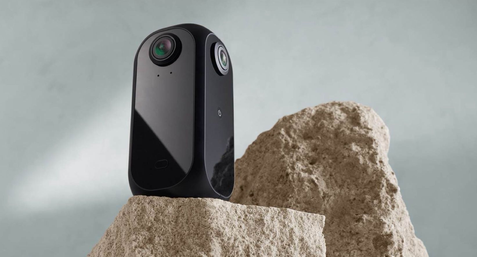 KartaCam 2 on a rough stone plinth against a soft grey-blue backdrop