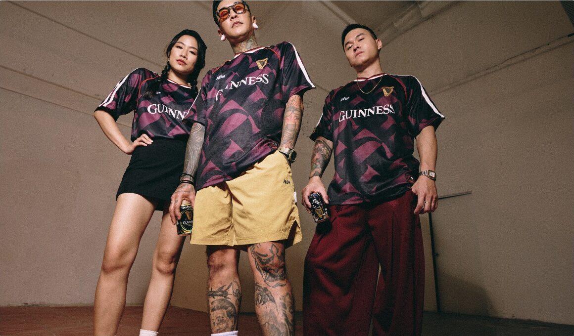 Three models in the jersey against a warm studio wall