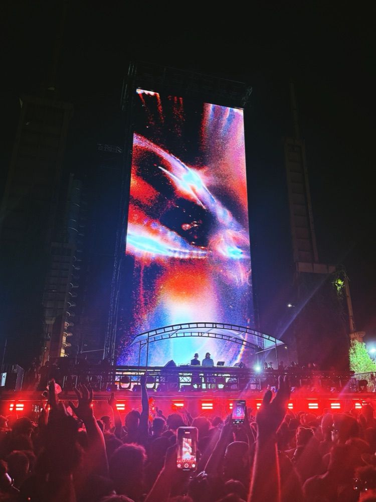 A festival main stage at night