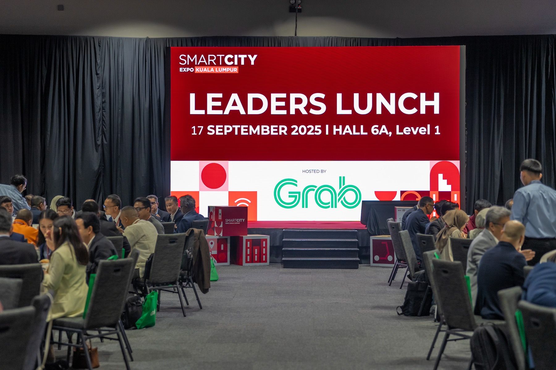 A leaders’ lunch at the expo, with Grab on stage