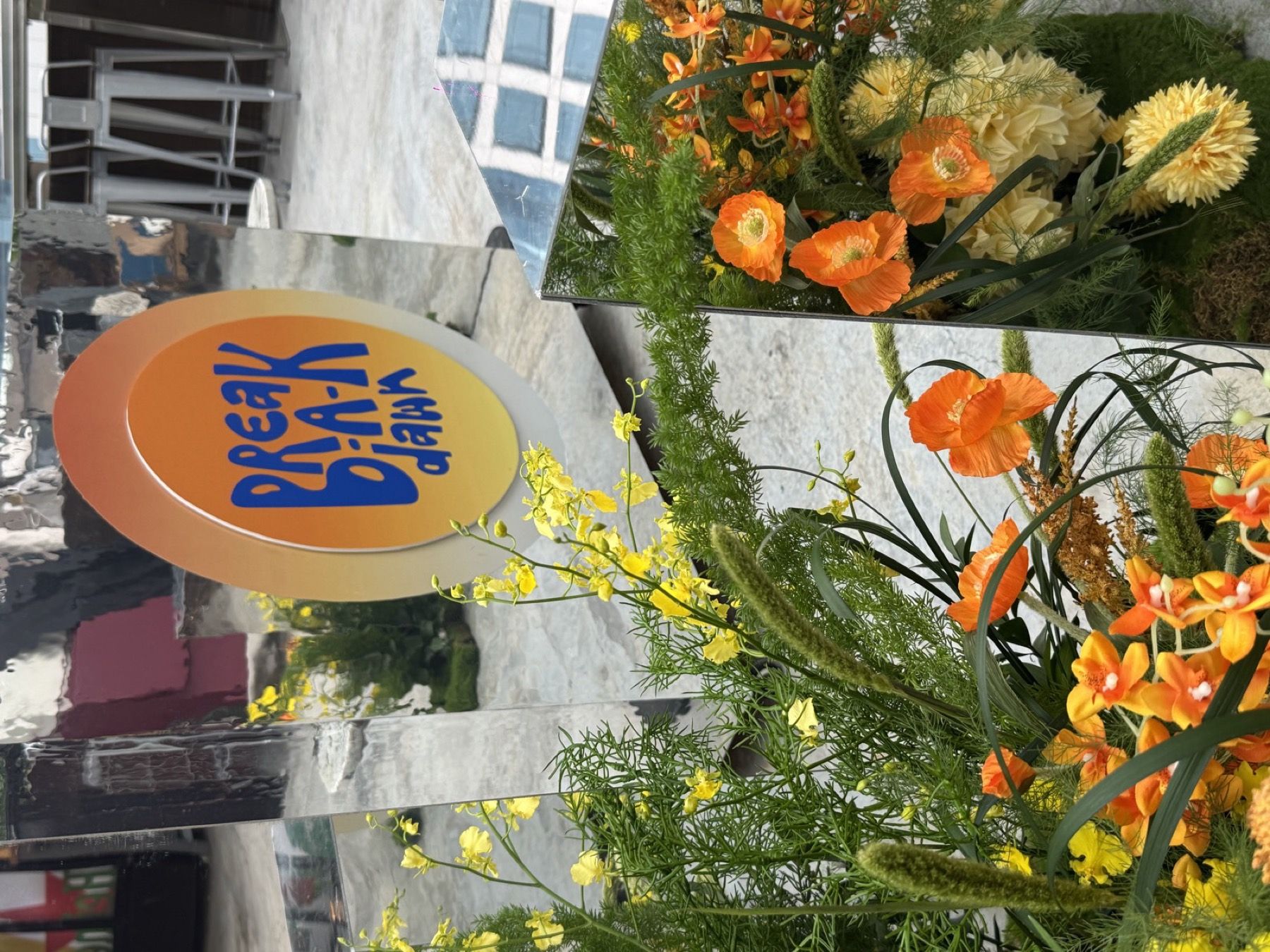 Flowers and signage at the entrance